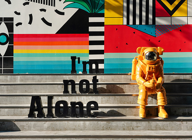 Loneliness abroad A very colorful sign that reads "I'm not alone"