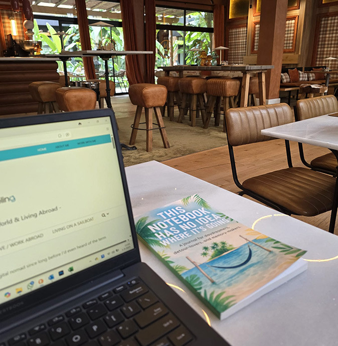 Safely using the hotel internet A laptop and a notebook on a table inside a hotel restaurant