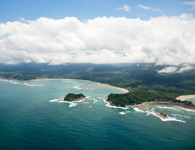 Aerial view of the coastline of Guanacaste showing sandy beaches and lush greenery