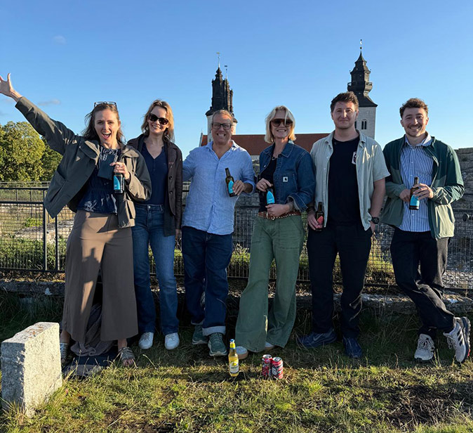 A coworking trip to Sweden organized by Feel.Travel A group of digital nomads posing for a picture in Sweden